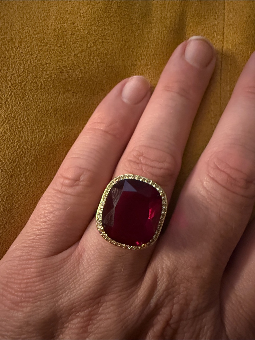 Gold Halo Ring with Deep Red Cushion Gem